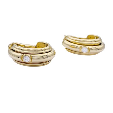 Piaget gold earrings, "Possession" collection.