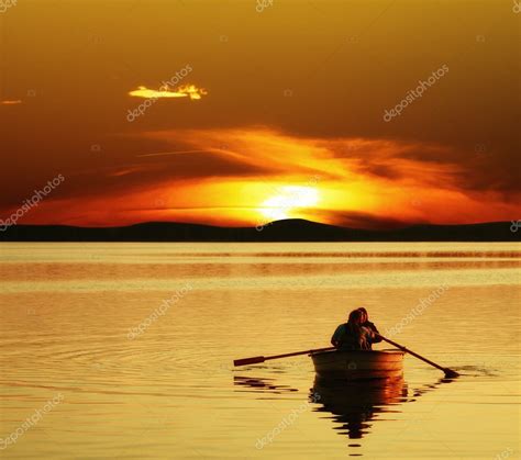 Couple rowing boat at sunset — Stock Photo © WDGPhoto #3935335