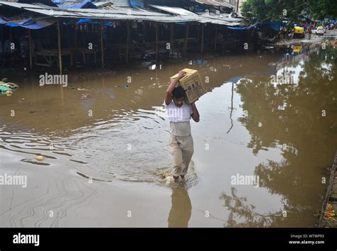 Dimapur, India. 12 September, 2019: An Indian man waded through water ...