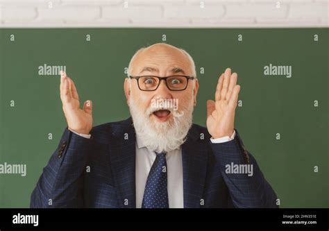 Old surprised face of funny teacher. Excited senior professor on blackboard Stock Photo - Alamy