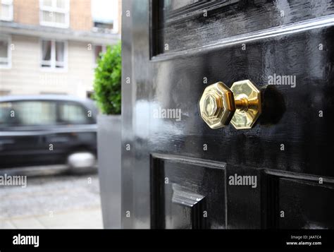 A Typically British Brass Door Knob On A Front Door On A Central London