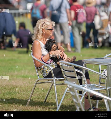 A Woman With Her Dog At The All About Dogs Show At The Norfolk