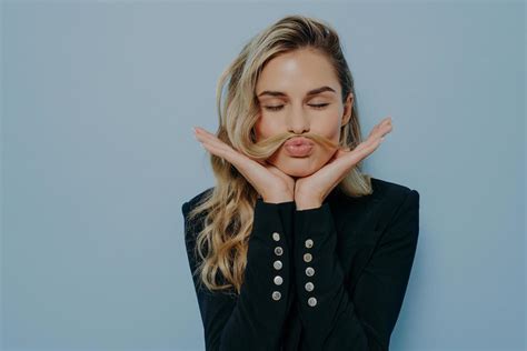 Crazy Blonde Woman Having Fun And Fooling Around Stock Photo At