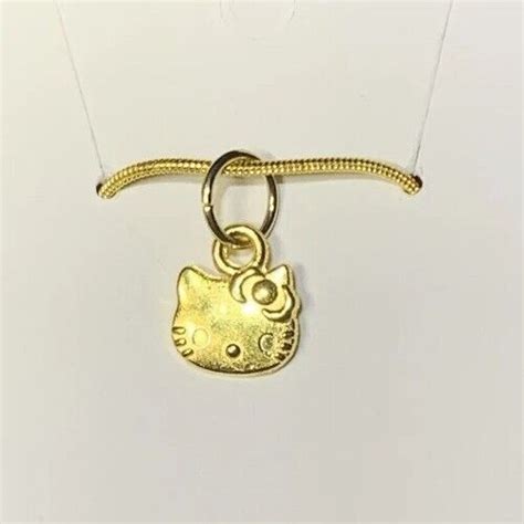 Small Gold Hello Kitty Charm Pendant On A Gold Snake Necklace Chain