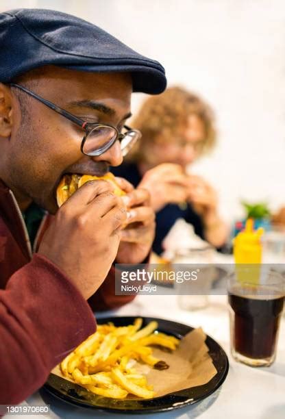 Man Eating Cheeseburger Photos And Premium High Res Pictures Getty Images