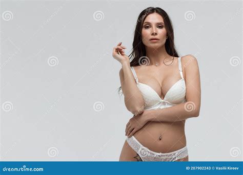 Hot Woman In White Lace Lingerie Looking At Camera Touching Body Stock Image Image Of Fashion
