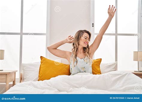 Young Woman Waking Up Stretching Arms At Bedroom Stock Image Image Of