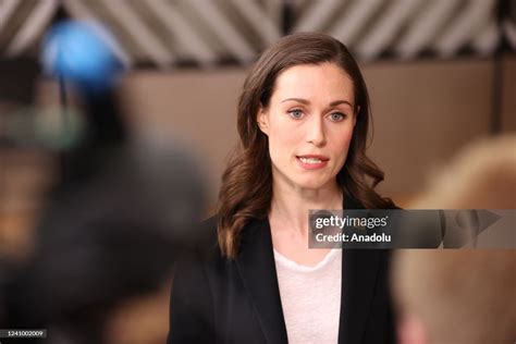 Finnish Prime Minister Sanna Marin speaks to media as she arrives for ...