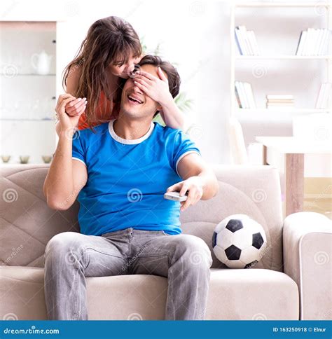 Wife Unhappy that Husband is Watching Football Stock Photo - Image of