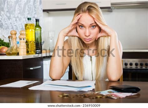 Serious Blonde Girl Money Documents Kitchen Stock Photo 236950009