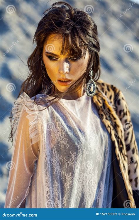 Closeup Beauty Portrait Of Attractive Brunette Woman With Makeup And Hairstyle In Translucent