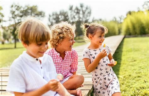 Group Of Kids Playing In The Park By Stocksy Contributor Marco Govel