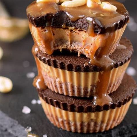 Chocolate Cupcakes Stacked On Top Of Each Other With Peanut Butter Drizzle