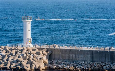 White Lighthouse On End Of Concrete Pier Stock Image Image Of Marina