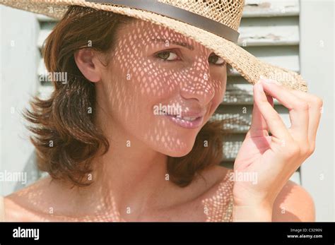 Woman Wearing A Sun Hat With Shadows On Face Stock Photo Alamy