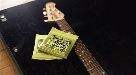 How to Restring an Acoustic Guitar - Easy Steps | Sharpens