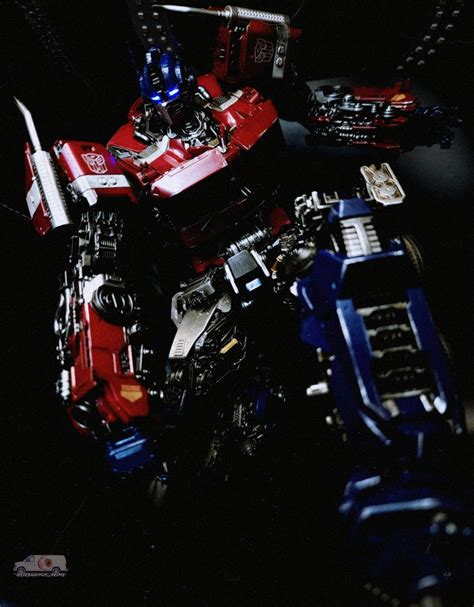 Three zero dlx optimus prime doing a super hero landing Transformers ...