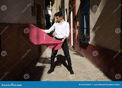 Flamenco And Gipsy Man Dressed In Black And White Shirt Dancing With A