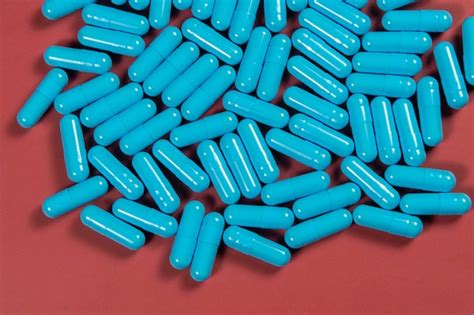 Textura De Las Pastillas De Cápsulas Antibióticas Azules Producción