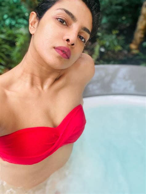 Priyanka Chopra Sizzles In Red Bikini While Enjoying Some Pool Time