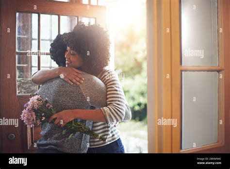 He Always Makes Her Feel Special A Young Woman Hugging Her Husband