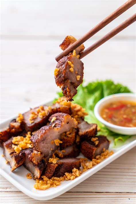 Premium Photo Fried Streaky Pork Or Crispy Pork Or Deep Fried Pork Belly