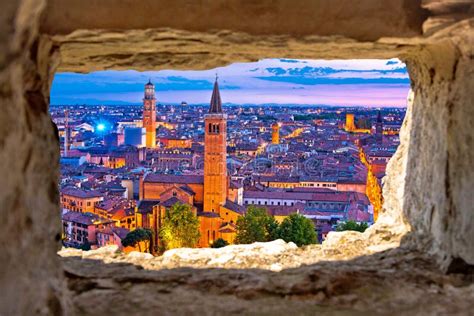 Verona Historic Skyline Evening View Through Stone Window Stock Photo