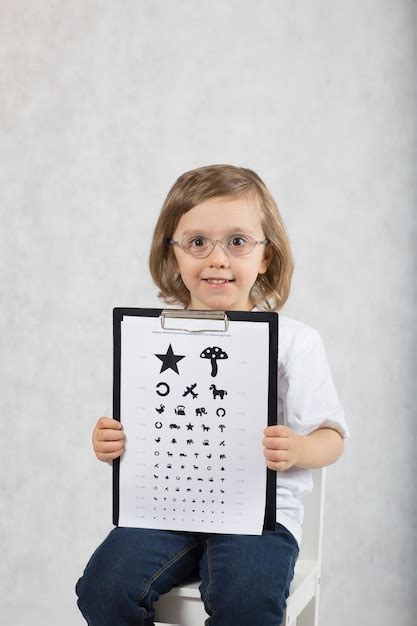 Premium Photo Ophtalmologist Checks Vision Of 5 Years Old Boy By