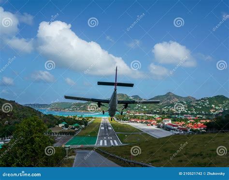 Plane Landing at Remy De Haenen Airport Also Known As Saint Barthelemy ...