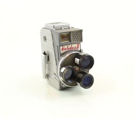 an old fashioned camera with two lens's attached to the front and back side