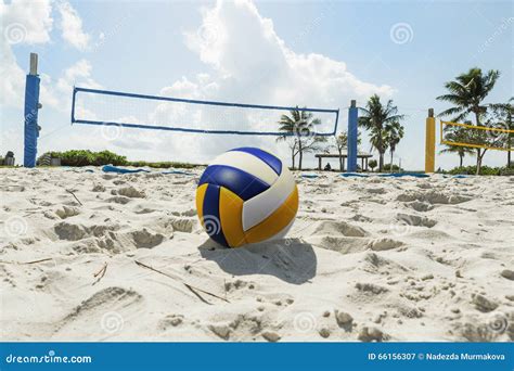 A Beach Volleyball Net On A Sunny Beach With Palm Trees Stock Image