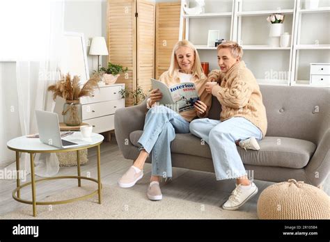 Mature Women Reading Magazine At Home Stock Photo Alamy
