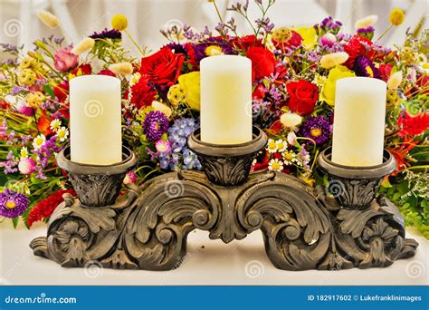 Candles On A Stand And Floral Arrangement Stock Photo Image Of