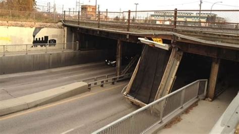 Dump Truck Hits Bridge Rips Off Box Cbc News