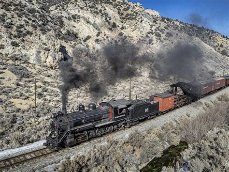 Nevada Northern Railway steam locomotive #93 pulls a wreck train out of ...