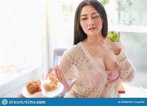 Portrait Asia Woman Wear Lingerie Or Underwear With Green Apple Holding