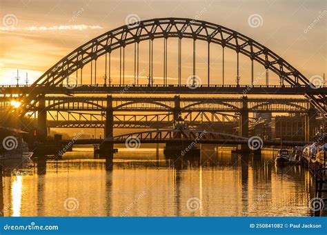 The Tyne Bridge At Sunset Reflecting In The Almost Still River Tyne