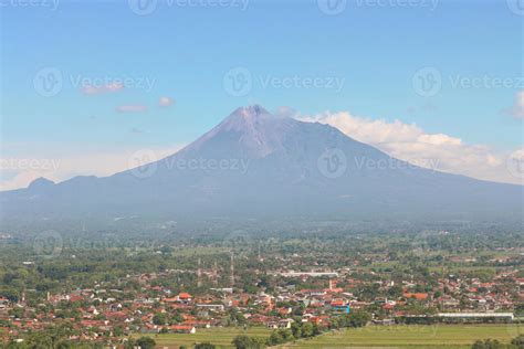 Aerial View Of Mount Merapi Landscape With Rice Field And Village In