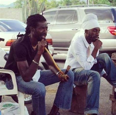 Buju & Sizzla holding a reasoning