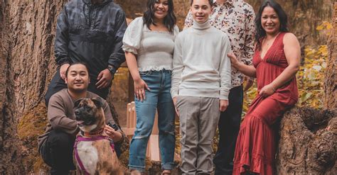 Family Posing with Dog · Free Stock Photo