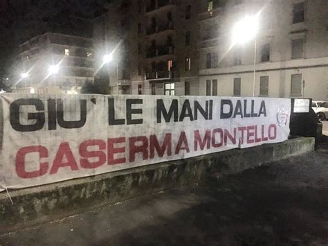 Migranti striscione di CasaPound Giù le mani dalla caserma Montello