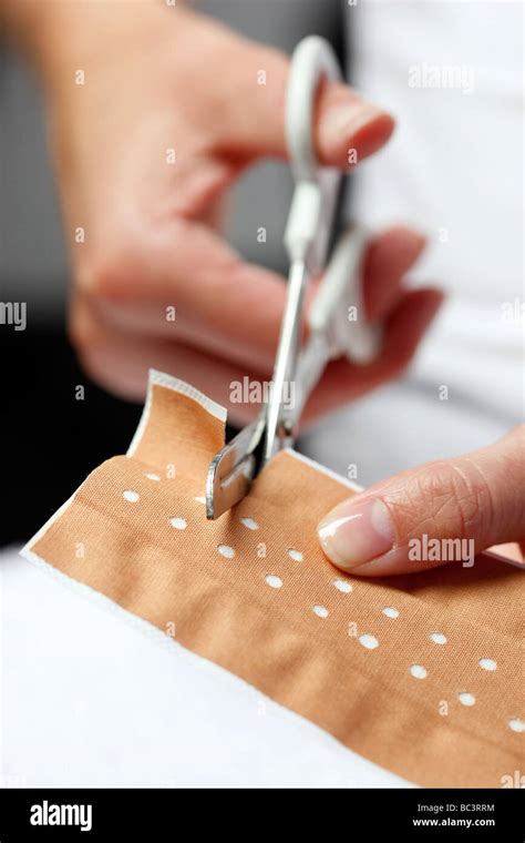 Plaster Cutting To Apply The Plaster To A Little Wound Stock Photo Alamy