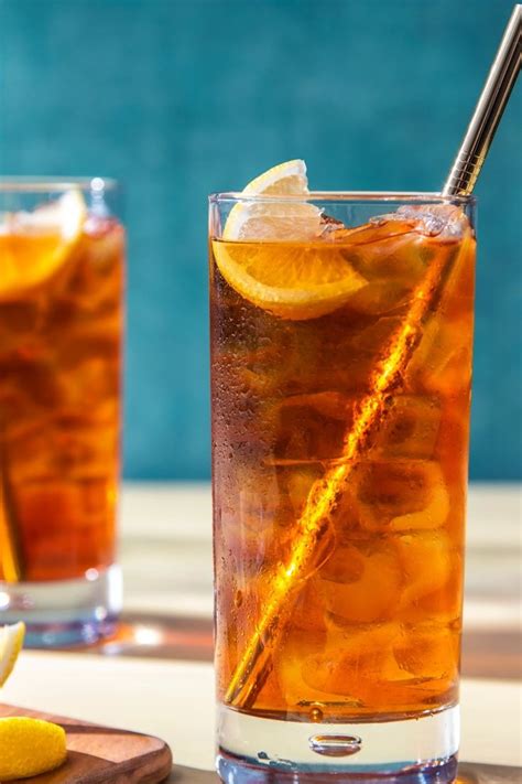 Two Glasses Filled With Iced Tea And Lemon Slices