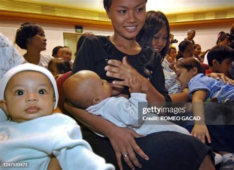 filipino eating   premium high res pictures getty images