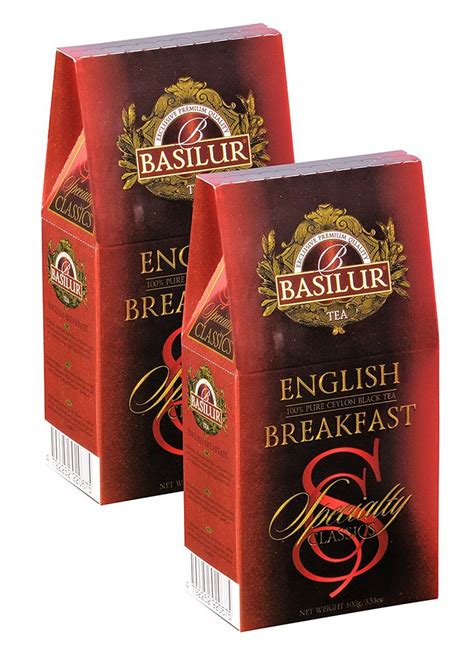 Two Bags Of English Breakfast Coffee Sitting Next To Each Other