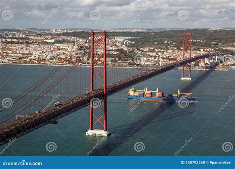 Tanker Ship Passes Under The The 25 April Bridge Stock Photo Image Of