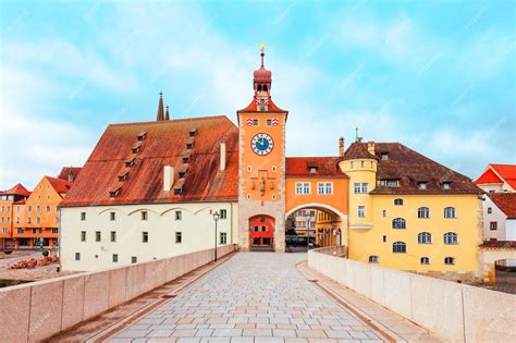 Premium Photo | Stone bridge and old city gate with bridge tower or ...