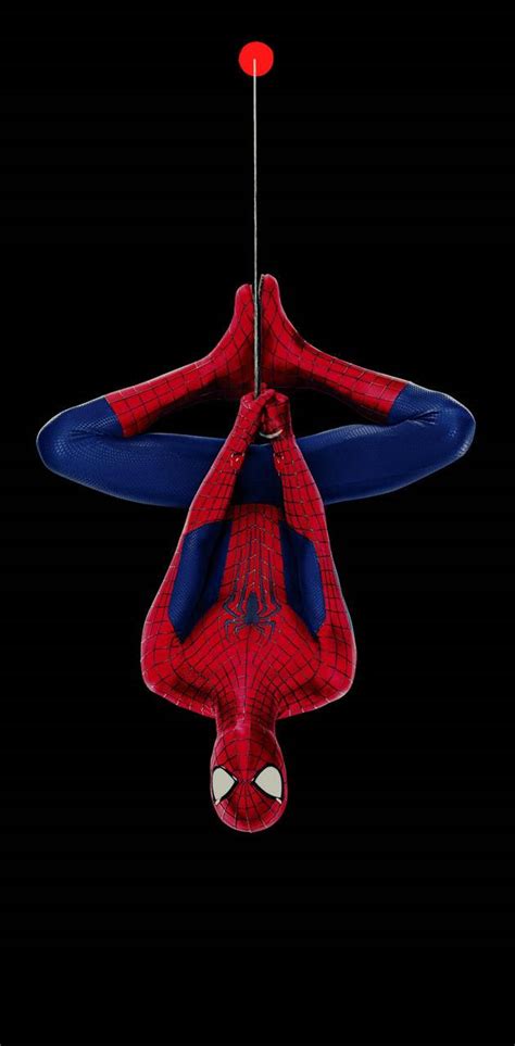 Download Spiderman Hanging Upside Down By The Punch Hole Wallpaper