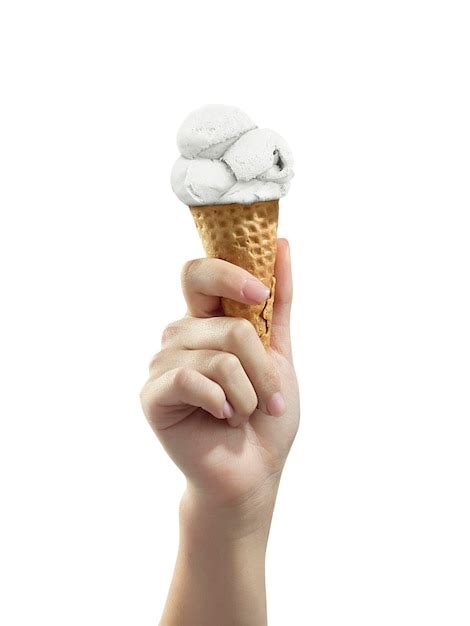 Premium Photo A Woman Hand Holding An Ice Cream Cone On A White