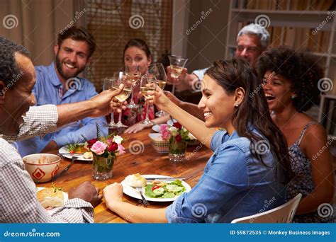 Friends at an Evening Dinner Party Stock Image - Image of adults, enjoying: 59872535